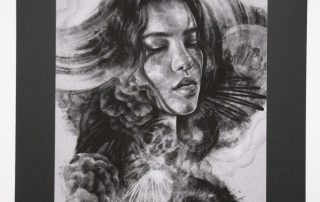 A black and white digital painting printed on canvas. The image shows a woman's face, her hair blends with the swirling background and whispy smoke like shapes surrounding her.